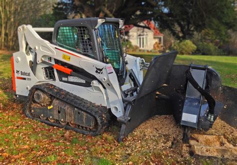 tree stump removal skid steer|bobcat skid steer stump grinder.